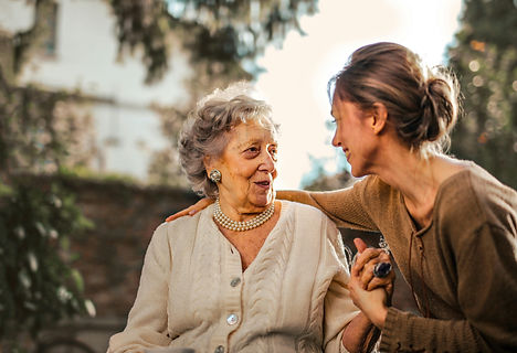 Texas Angels healthcare professional speaking with an older adult